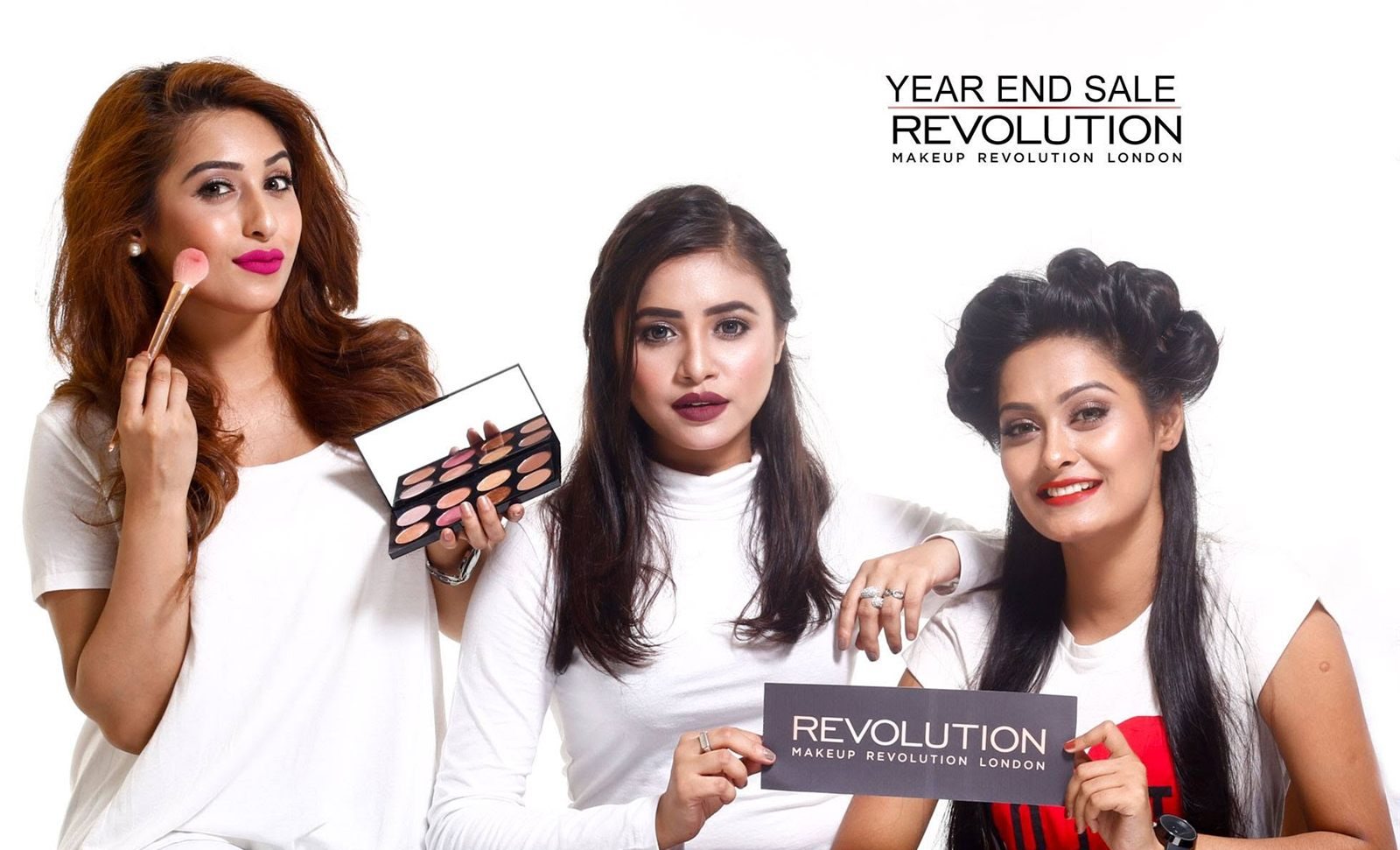 Three models with Makeup Revolution products in a TheMallBD year-end sale campaign